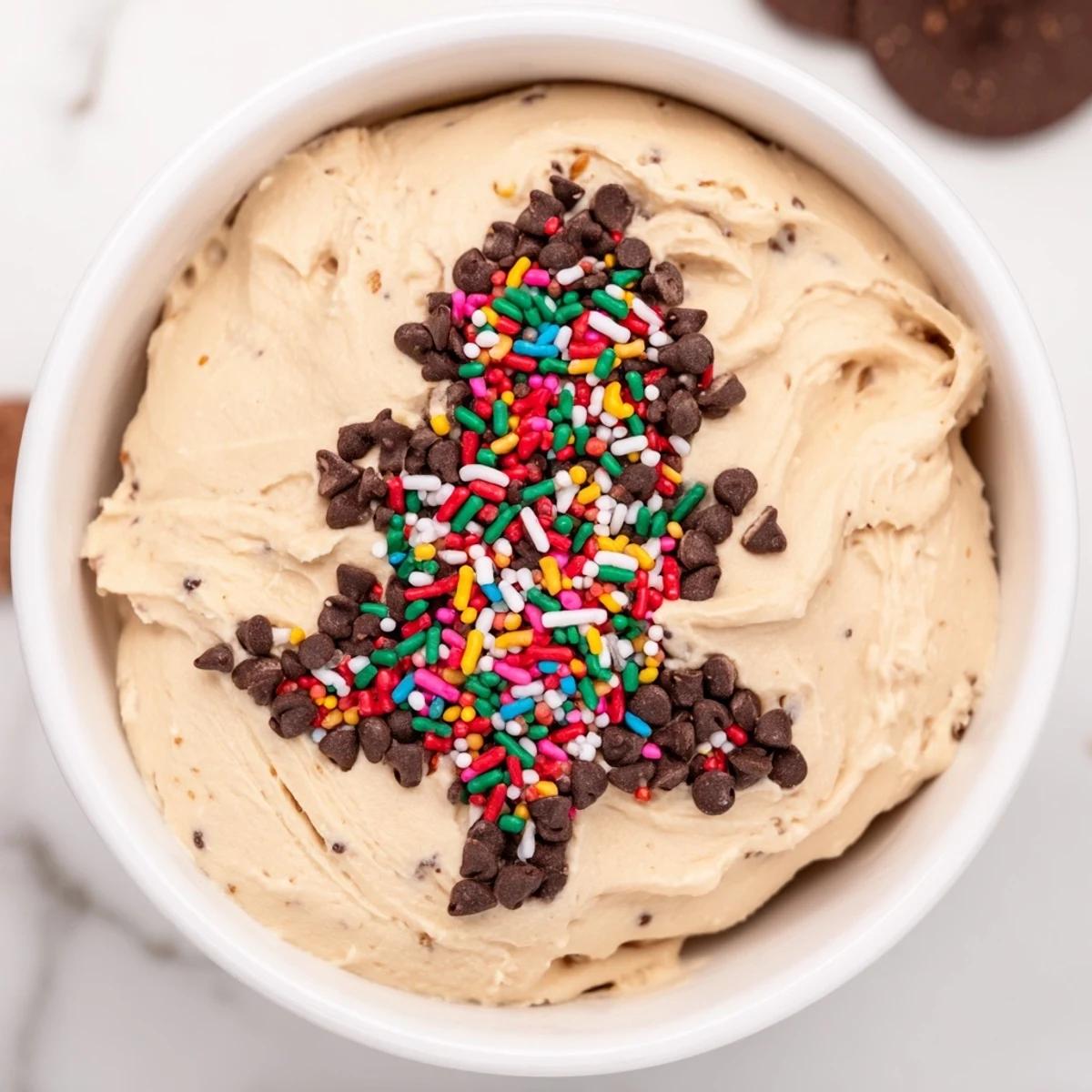 Festive Tree Brownie Dip, a creamy, chocolatey dessert, is served with graham crackers ready to be dipped.
