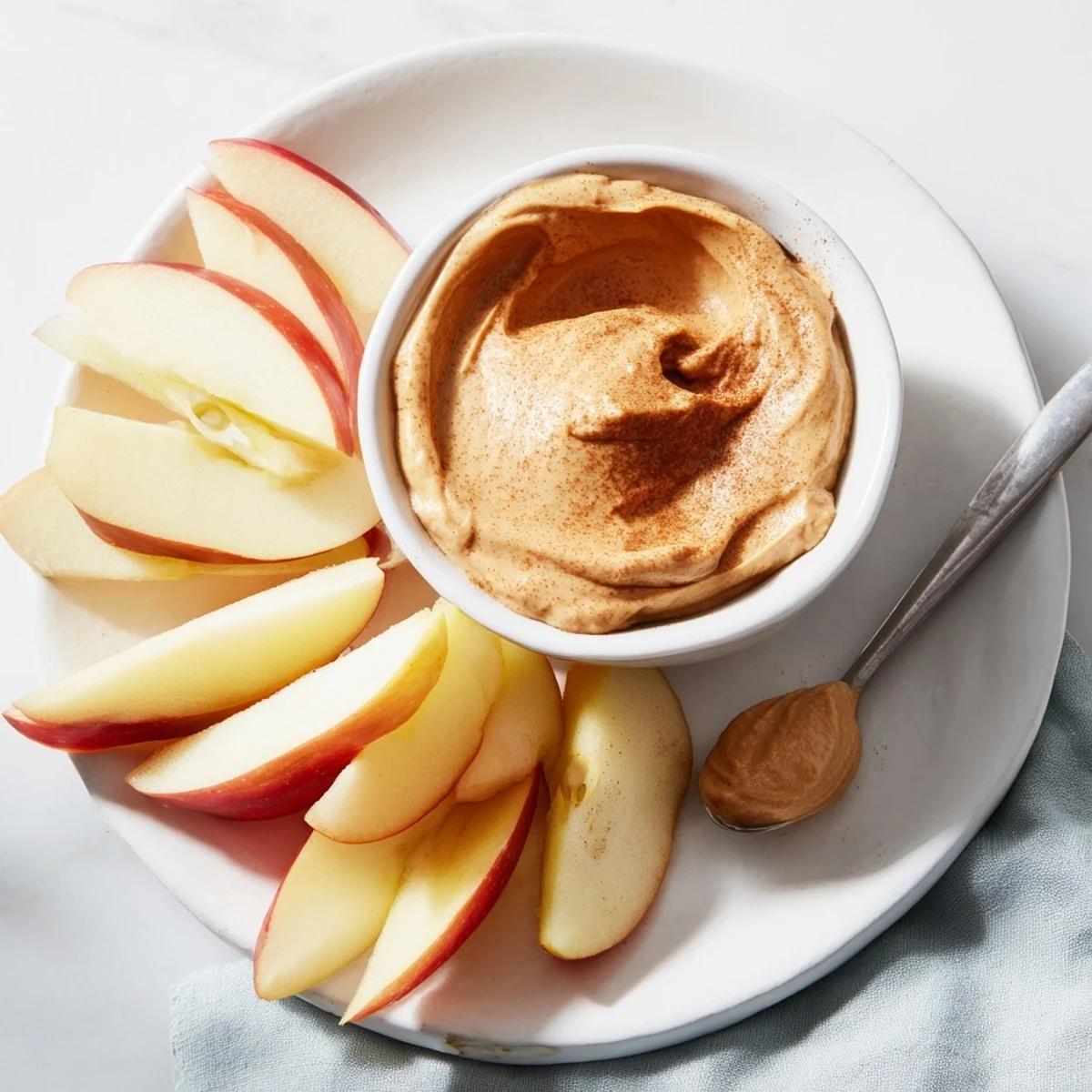 Crisp apple slices with creamy peanut butter dip, a quick and healthy snack.