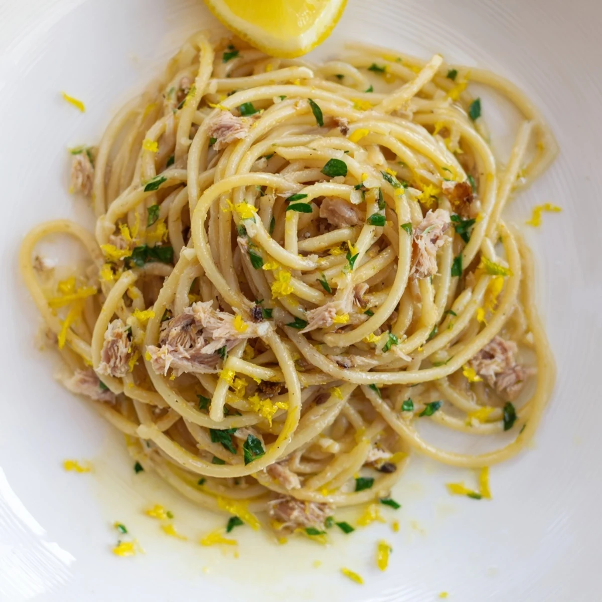 A close-up of steaming Lemon-Garlic Tuna Spaghetti, a simple, delicious weeknight dinner.