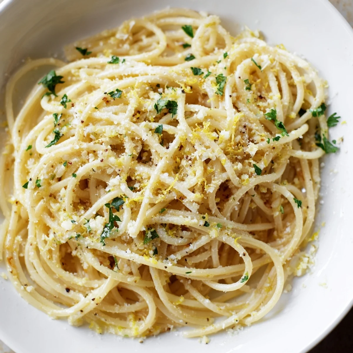 Steaming bowl of Garlic Butter Noodles, fragrant and coated in rich, melted garlic-infused butter, ready to eat.