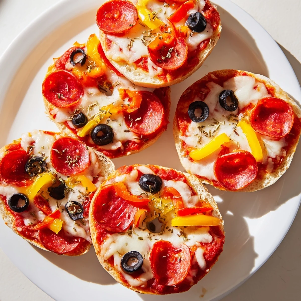 Enjoy fresh-from-the-air-fryer mini bagel pizzas; the perfect bite-sized party appetizer.