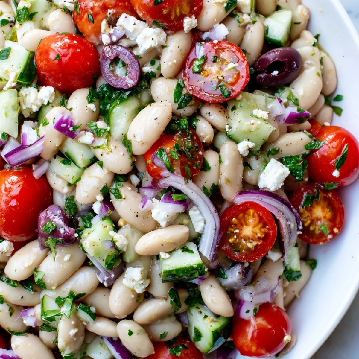 Mediterranean White Bean Salad served in a bowl, showcasing vibrant colors and fresh ingredients.