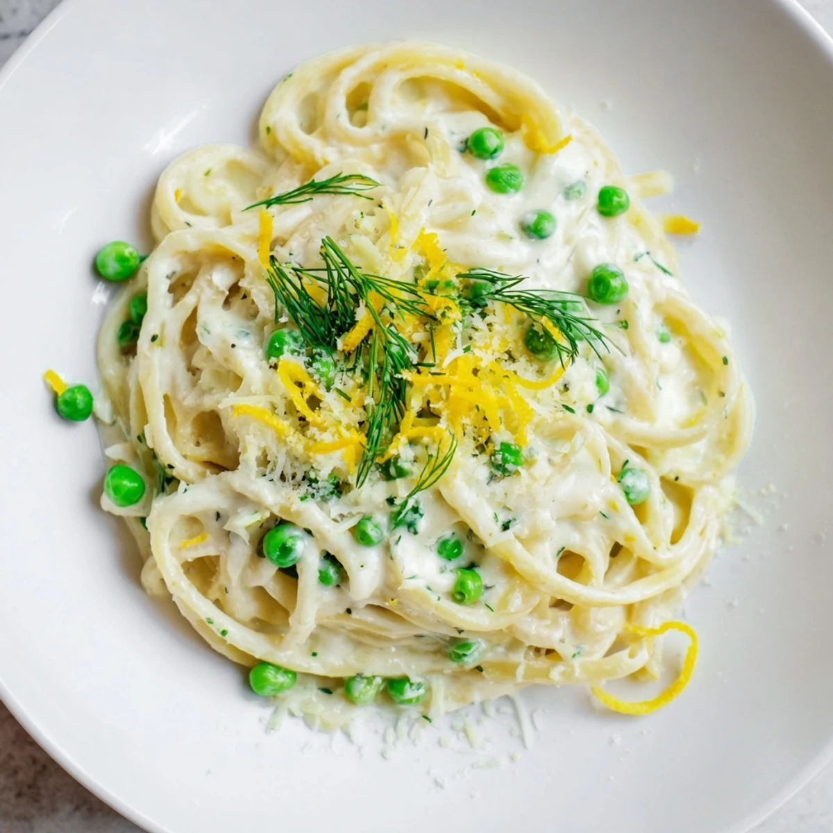 A close-up of Creamy Dill Pasta, showcasing perfectly cooked noodles and vibrant green dill sprigs.
