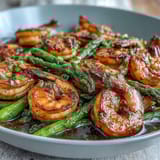 Healthy Easy One-Pan Lemon Garlic Shrimp and Asparagus, roasted to perfection with fresh lemon and garlic for a bright, flavorful dinner.