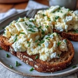 Golden eggs and cottage cheese scrambled to soft perfection, topped with fresh chives.  
