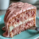 A stunning Bridal Shower Rosé Velvet Cake artfully decorated with a flowing gold ganache.