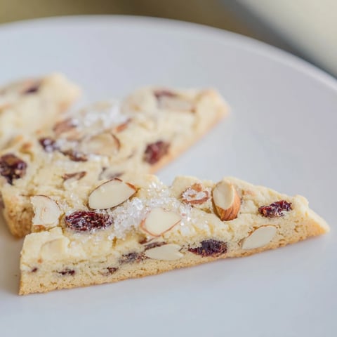 Golden, buttery Cherry Almond Shortbread Wedges, perfect for teatime with a delicate, crumbly texture.