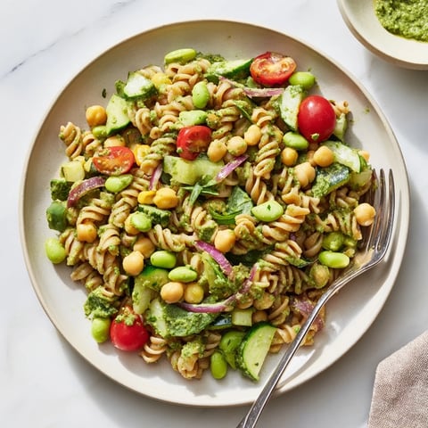 Vibrant Holiday Glow Green Goddess Protein Pasta Salad, featuring creamy dressing, and fresh herbs, ready to serve.