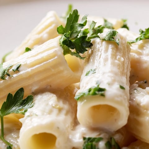 Creamy Milk Pasta One-Pot simmering in a skillet with glossy Parmesan sauce coating short pasta and chopped parsley garnish.  