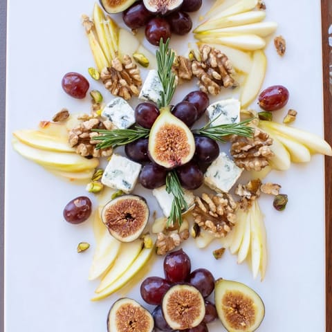 Beautiful Fig and Walnut Star Board arranged with fresh figs, walnuts, and vegan cheese waiting to be enjoyed.