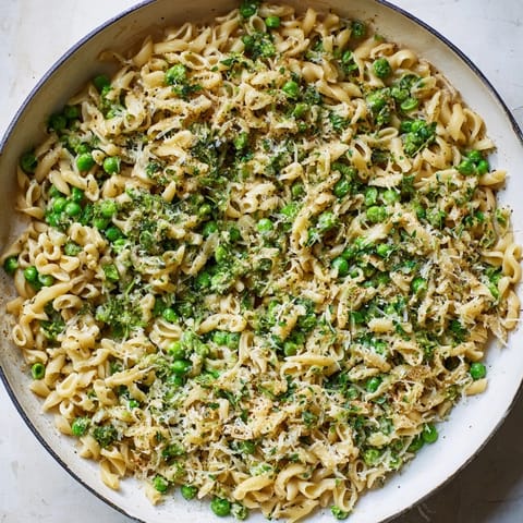 A close-up of steaming Garlic Butter Ditalini with peas, perfect for a cozy weeknight meal.