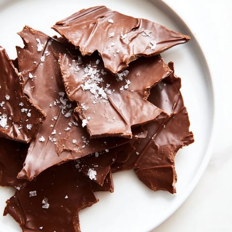 Crispy potato chips covered in smooth, rich chocolate form this delicious Chocolate Potato Chip Bark.