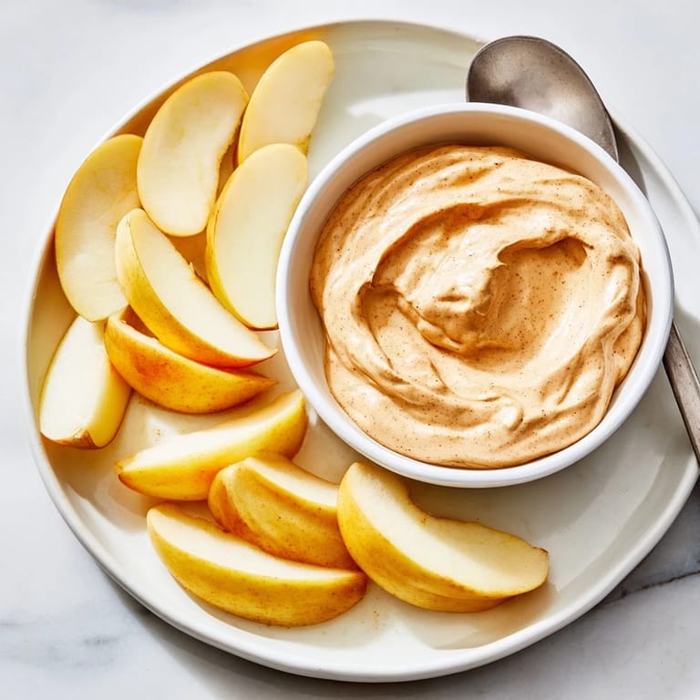 Delicious apple slices and a sweet peanut butter dip, ready for dipping and enjoying.