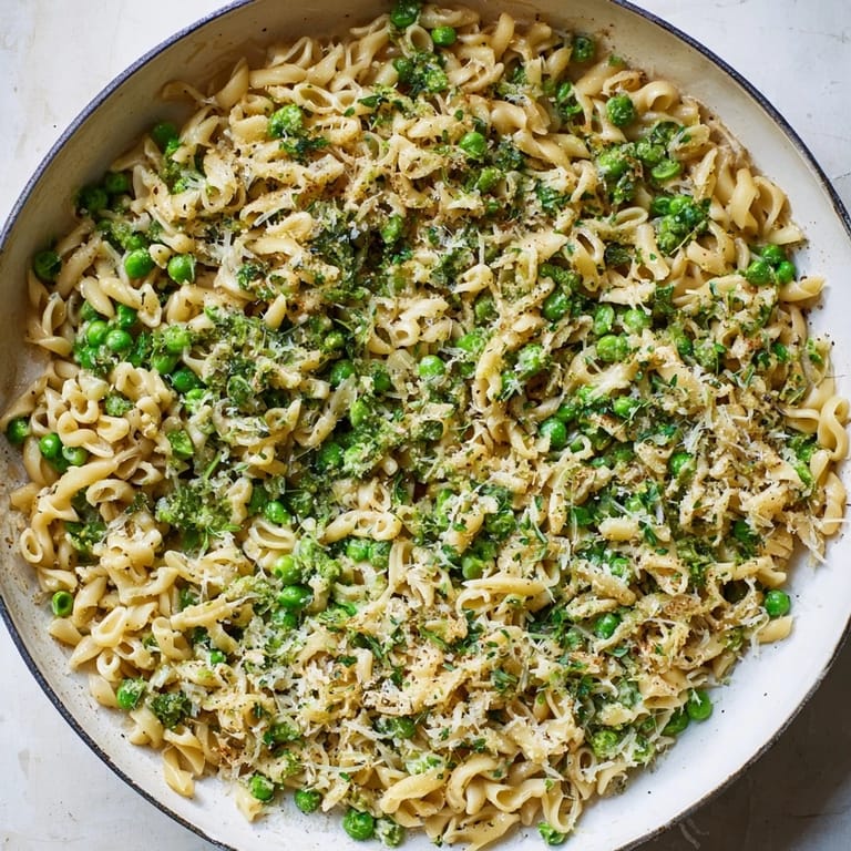A close-up of steaming Garlic Butter Ditalini with peas, perfect for a cozy weeknight meal.