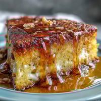 A golden, moist Southern-style cornbread baked in a cast-iron skillet, served warm with luscious honey butter for the ultimate comfort food experience.