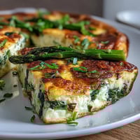 Spring Veggie Frittata with Asparagus and Goat Cheese, a light and fluffy egg bake loaded with fresh spring vegetables and creamy goat cheese.